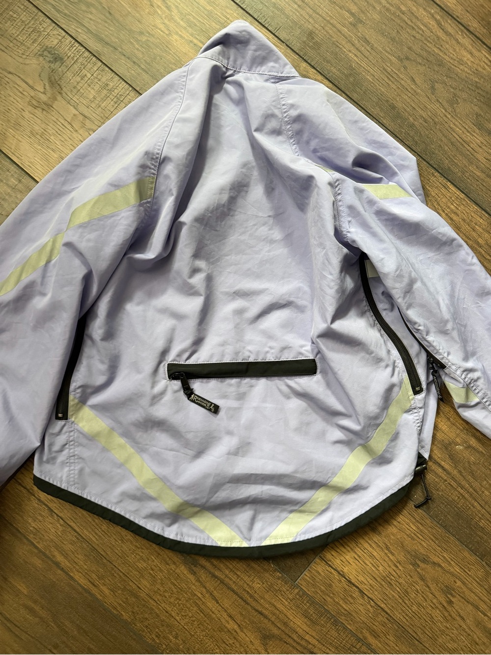 The Running Room Lightweight Lavender Hooded runningJacket with Reflective Trim